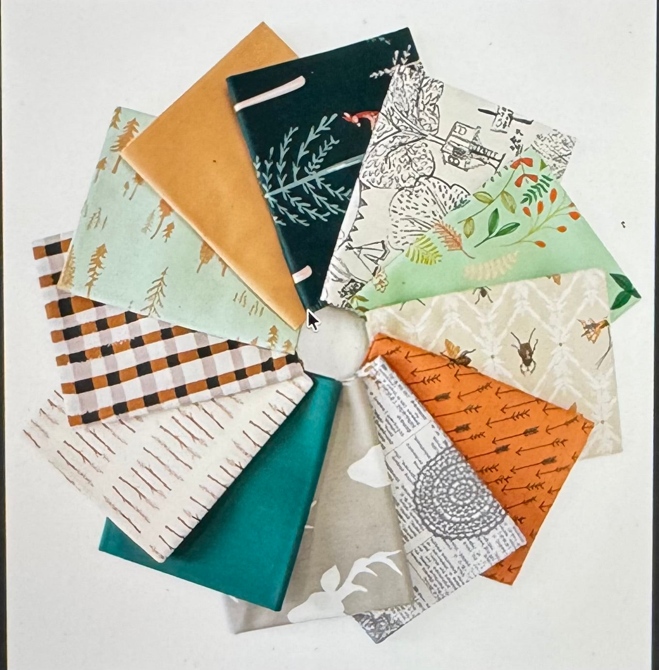 Collection of fabric swatches with various patterns arranged in a circular fashion.
