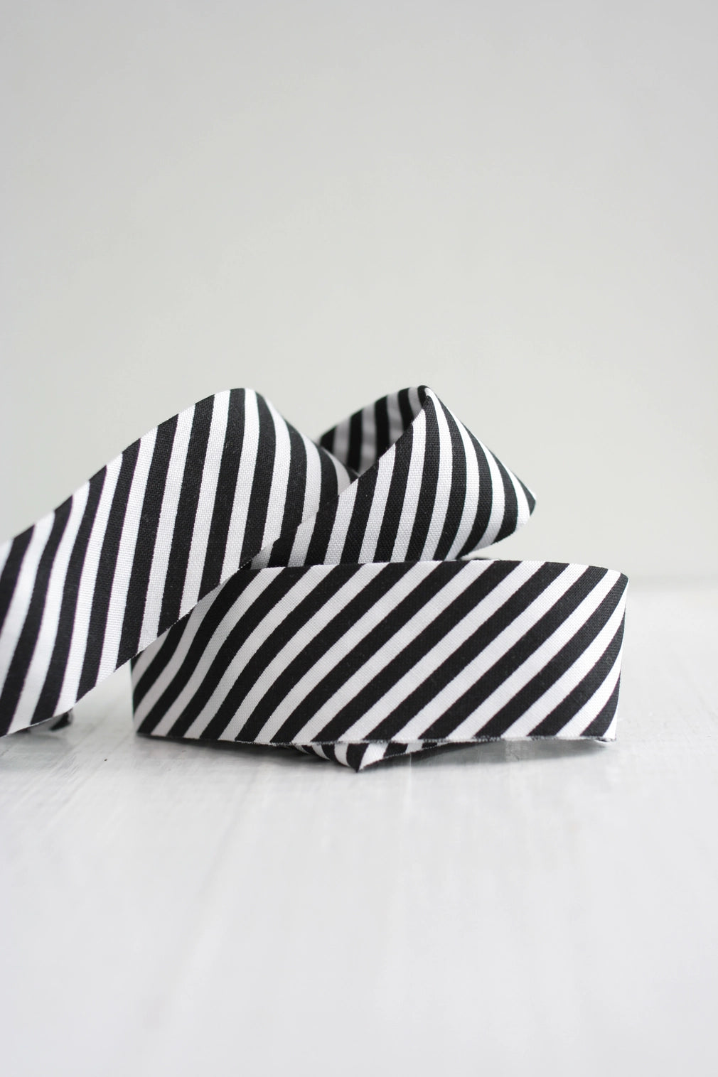 Black and white bias tape on a light gray background