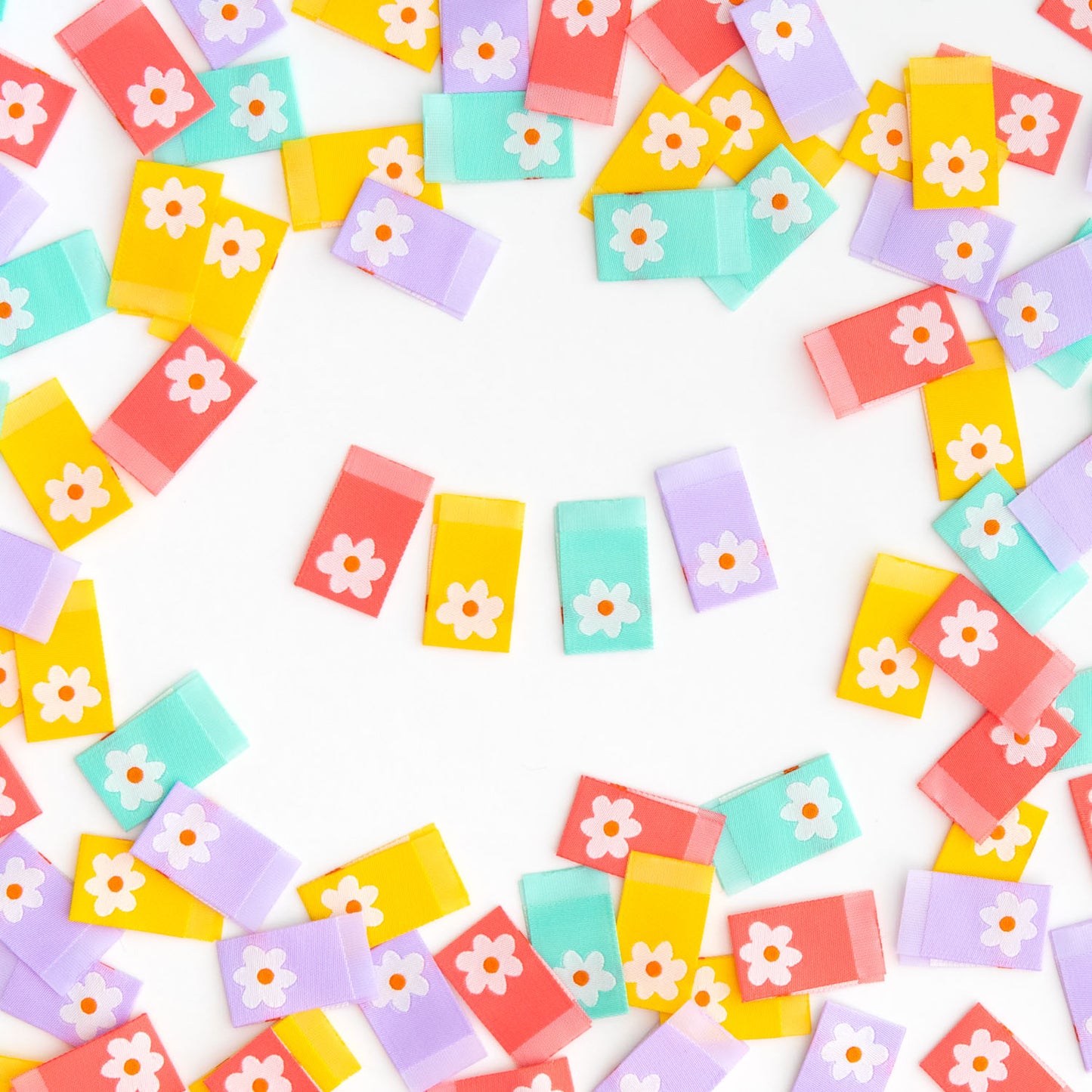 Colorful tags with floral designs on a white background