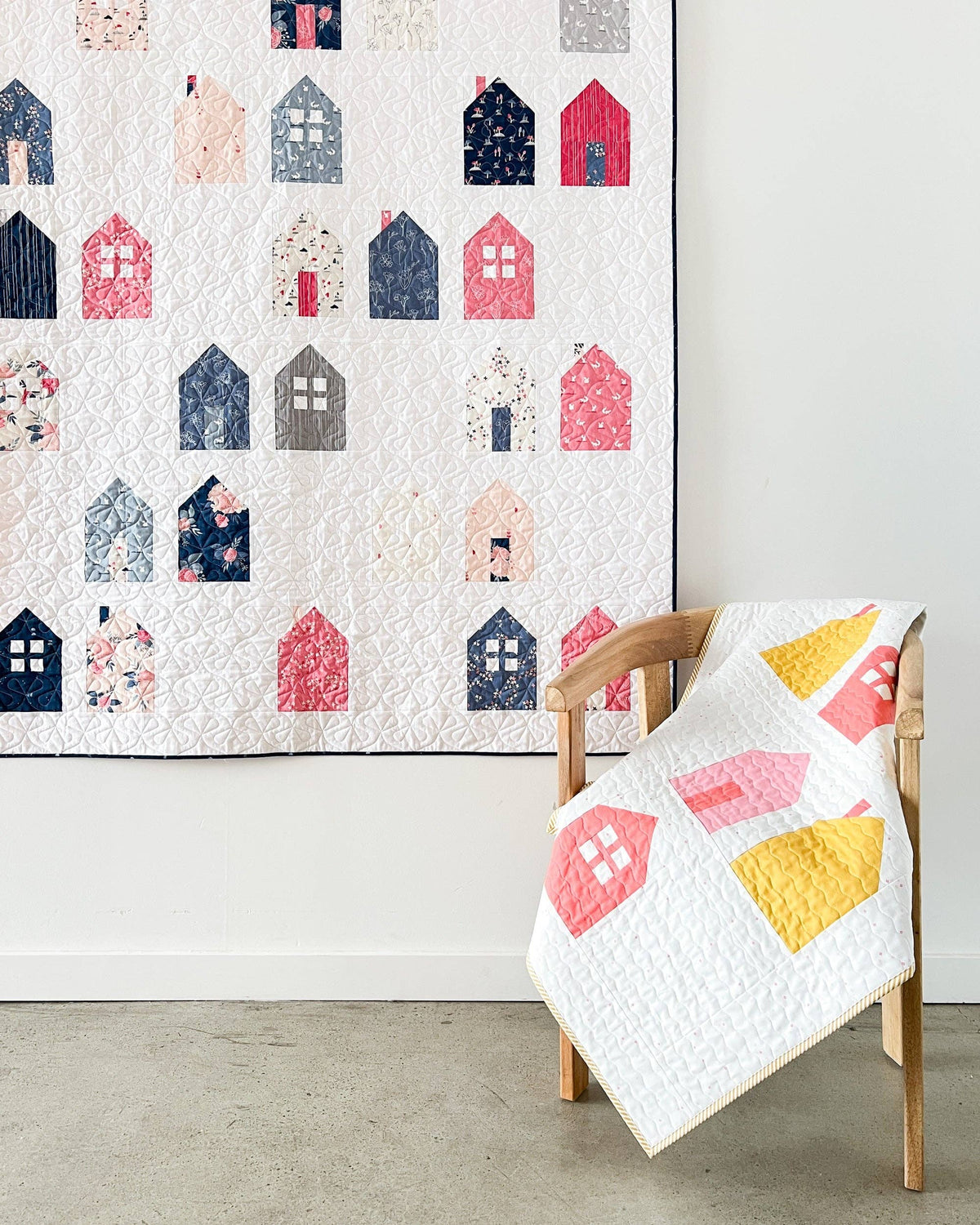 Quilt with house pattern on a chair and wall