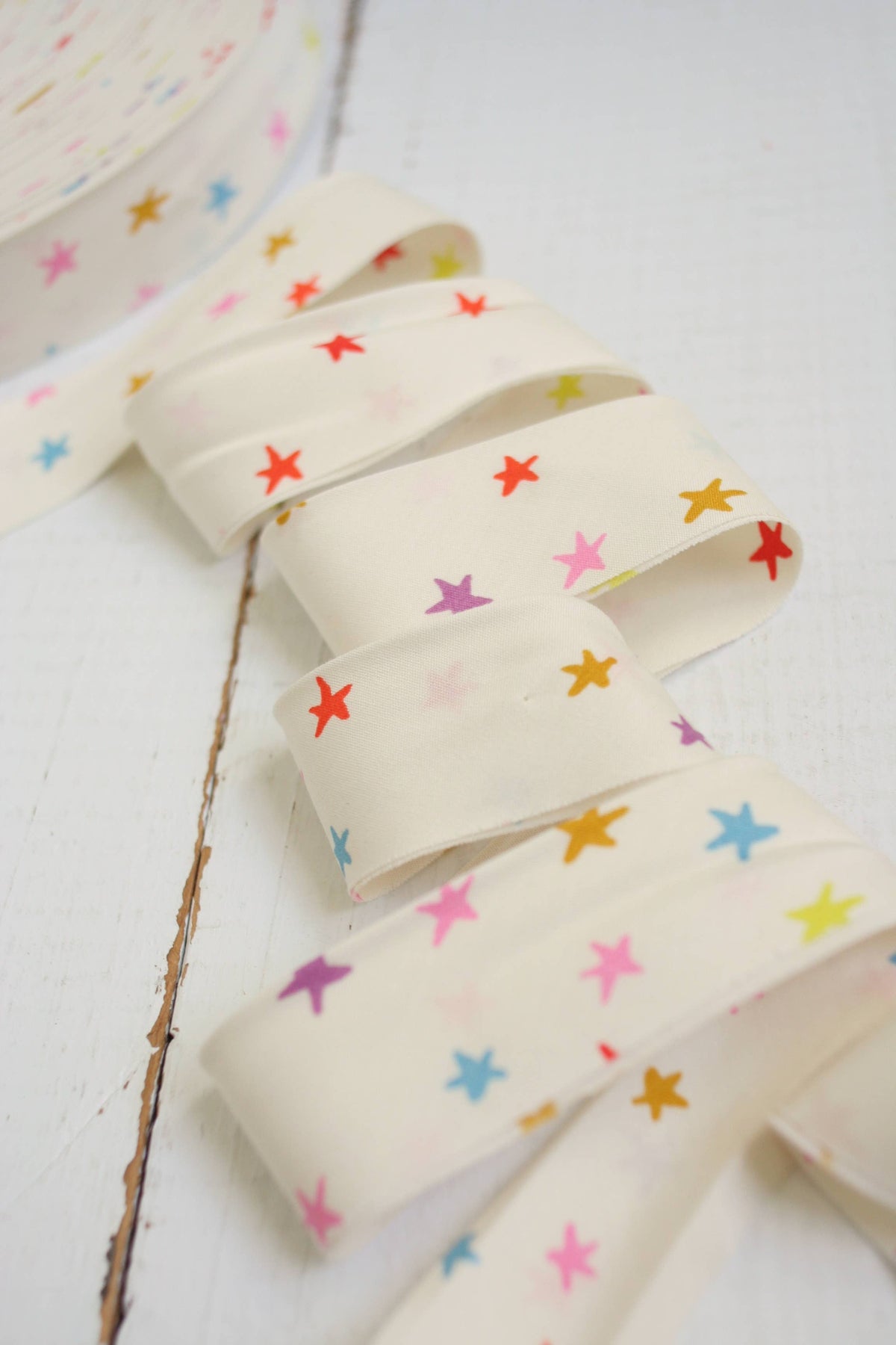 Bias Quilt Binding with colorful star pattern on a white background