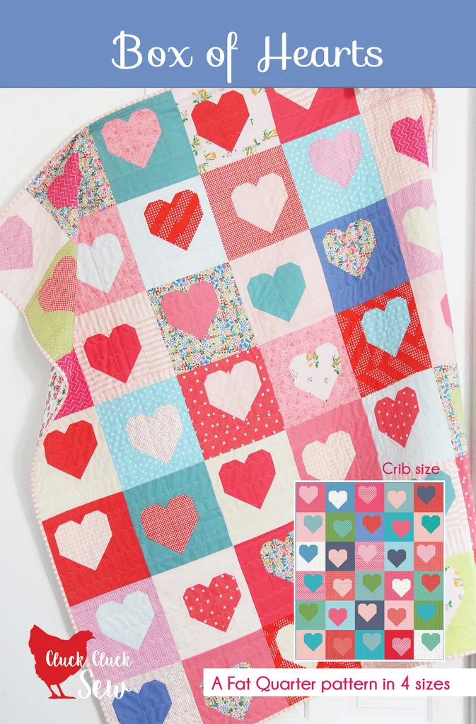 Quilt with heart patterns and 'Box of Hearts' text on a blue background