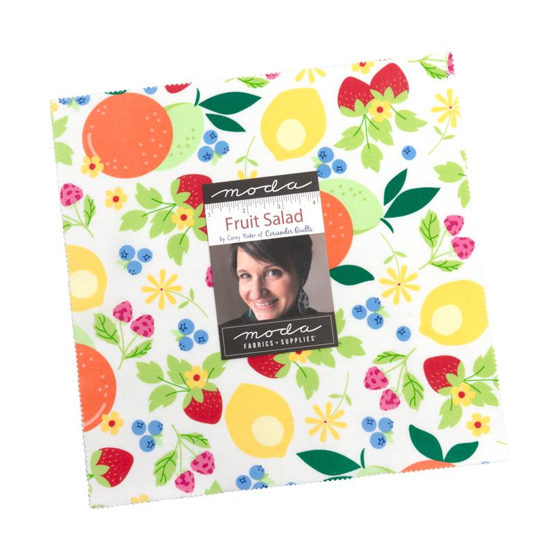 Fabric with colorful fruit pattern and Moda label on a white background
