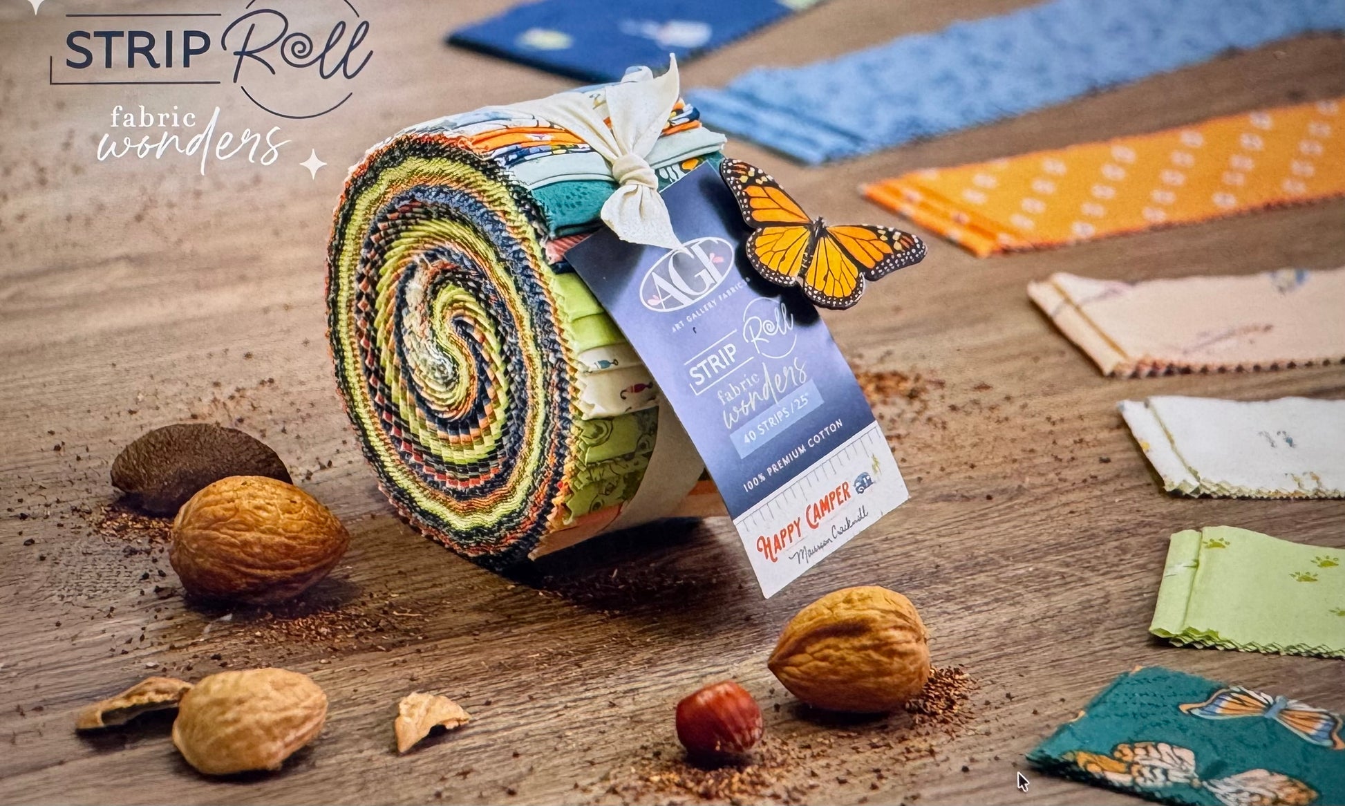 Fabric roll with colorful patterns on a wooden surface with decorative elements.