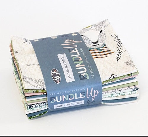 Stack of fabric bundles with 'Bundle Up' label on a white background
