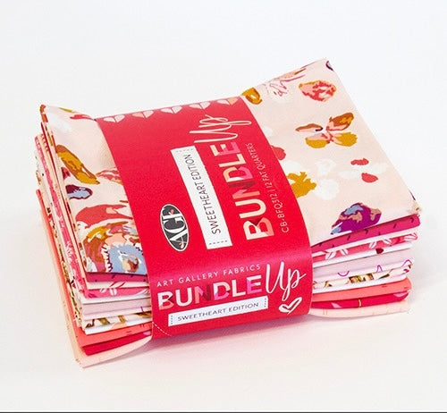 Stack of fabric bundles with a red packaging label on a white background