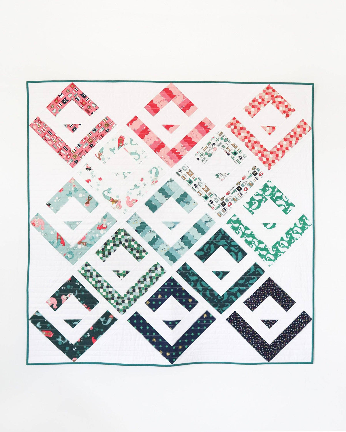 Quilt with geometric pattern on a white background