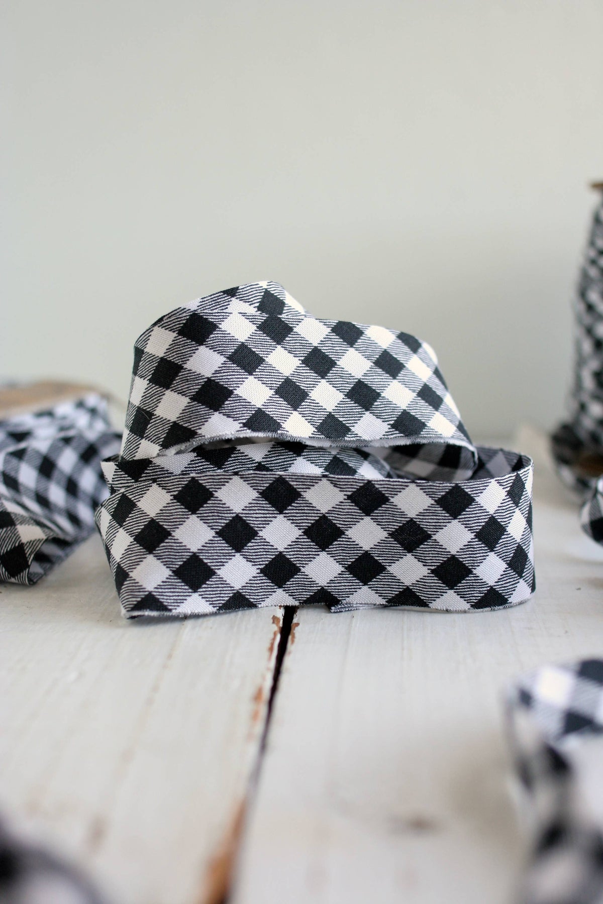 Black and white checkered ribbon on a wooden surface