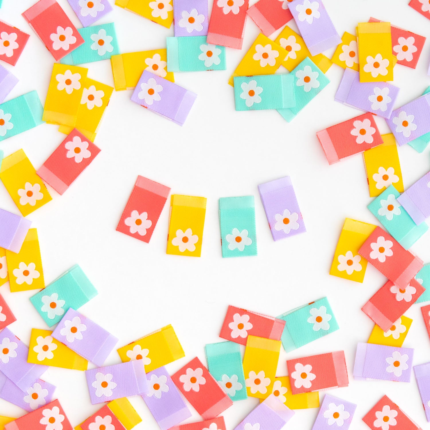 Colorful tags with floral designs on a white background