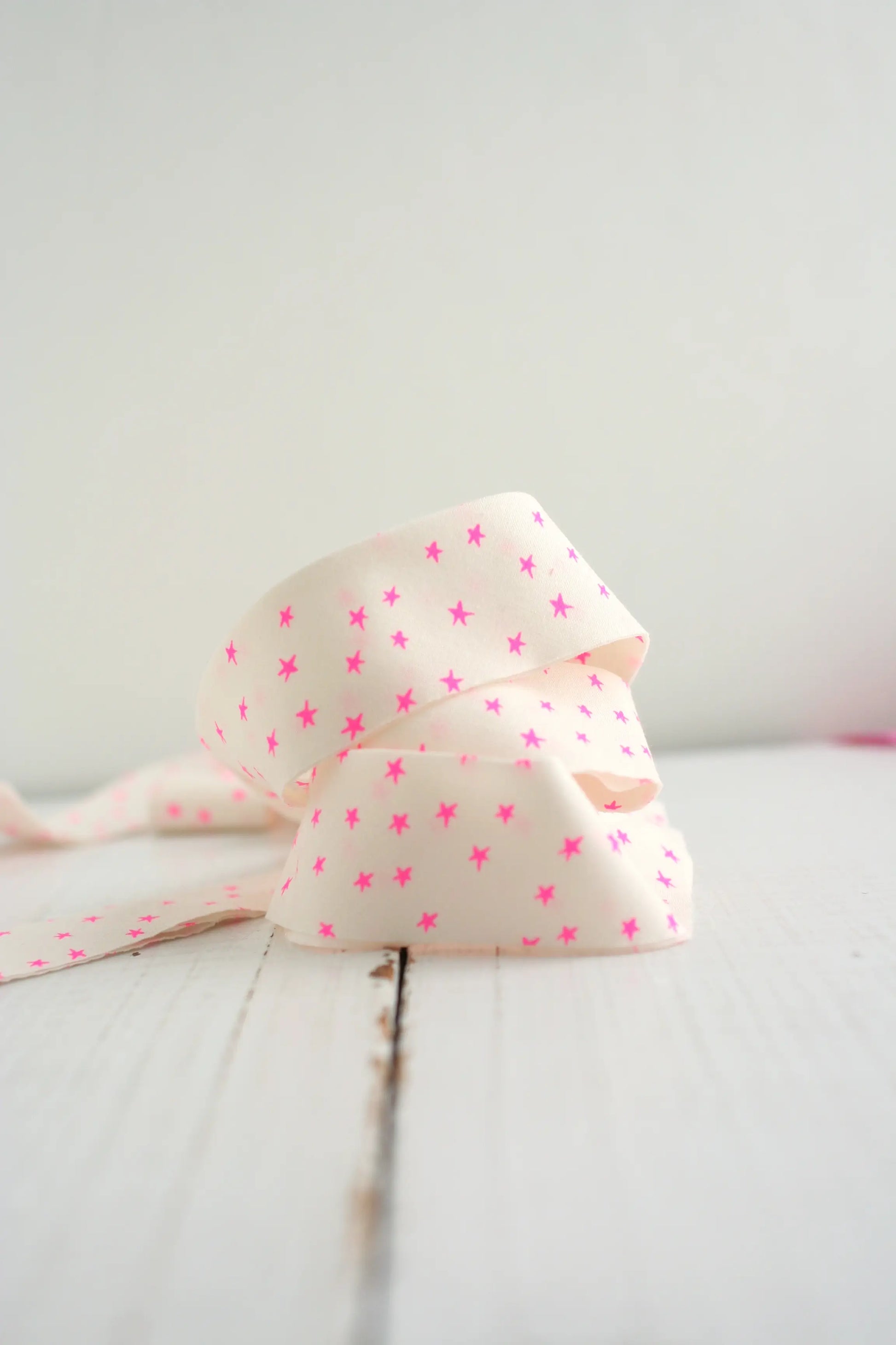 white with pink stars bias tape on white background