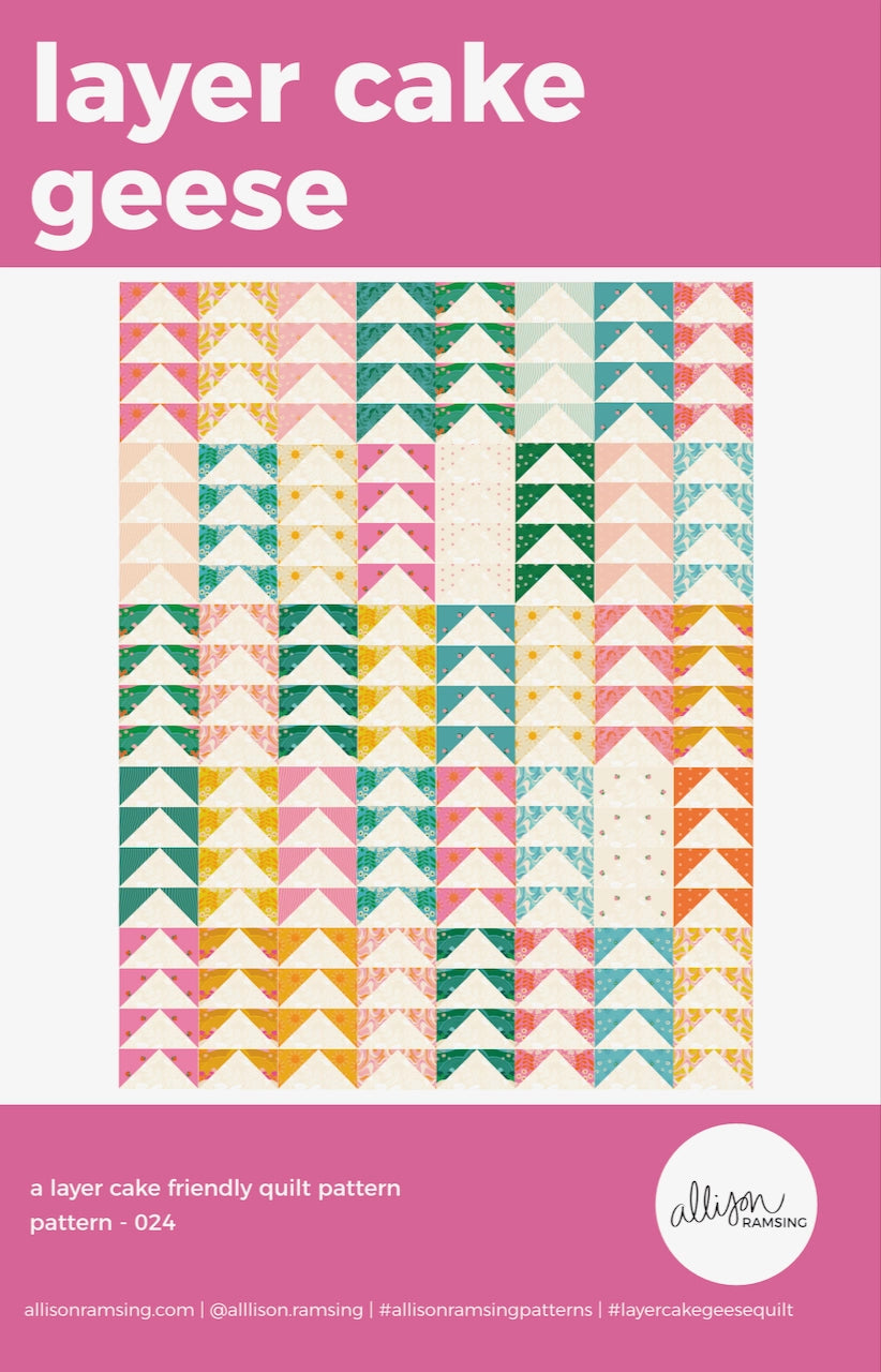 Quilt pattern cover with colorful triangle design and pink border