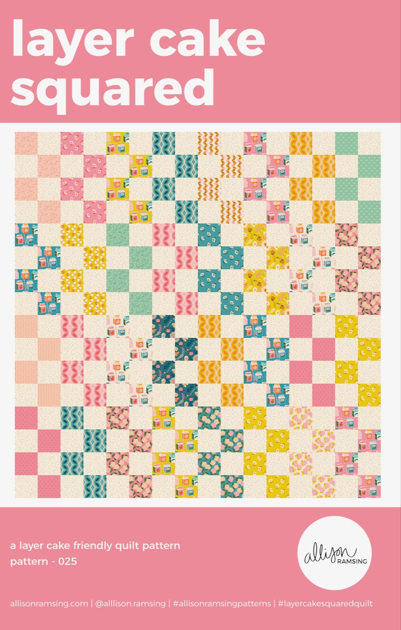 Quilt pattern cover with colorful square design and pink border
